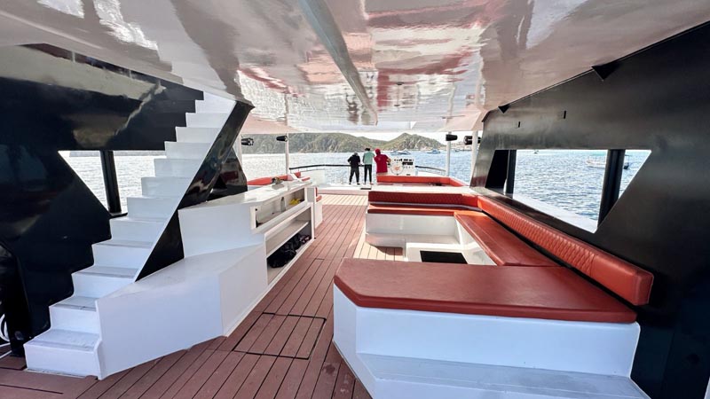 Modern and stylish lower deck seating area on a Cabo San Lucas fishing charter, featuring comfortable benches and scenic ocean views, perfect for relaxing during fishing trips.