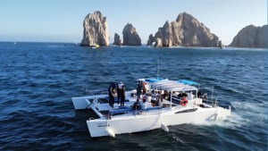 Fishing in Cabo San Lucas Mexico – Scenic Charter Catamaran Anglers on a catamaran near the Arch, illustrating fishing in Cabo San Lucas Mexico